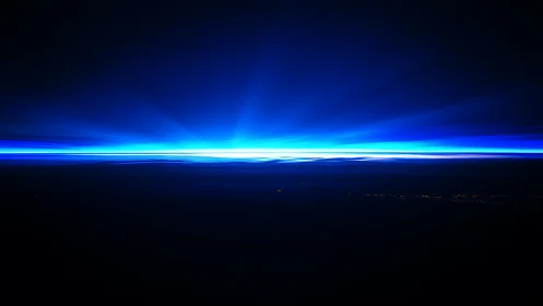 Celestial blue horizon flare ignites a midnight dreamscape.