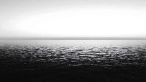 Monochrome seascape horizon with calm rippled water plane