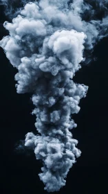 Vertical dense smoke column forms against black backdrop