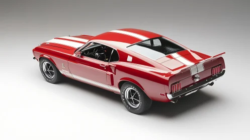 Red classic fastback muscle car with white racing stripes.