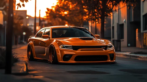 Orange widebody muscle car on empty city street at sunset.