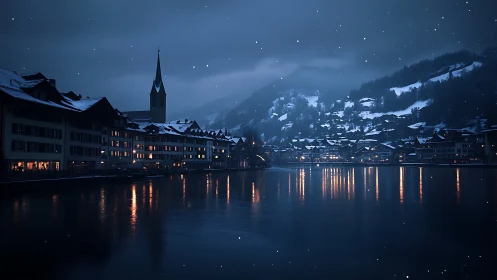 Snowy lakeside town at night with warm window lights.