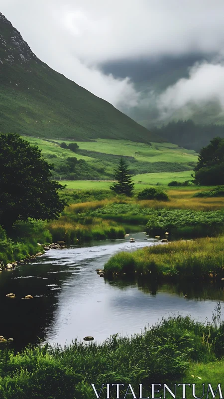 Mist-draped valley river curling through lush emerald hills.