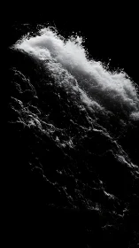 High contrast closeup of crashing waterfall in darkness.