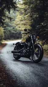 Custom black motorcycle stands on wet forest road in bokeh light