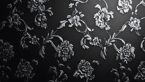 Silver floral embossing shimmers across a deep black surface