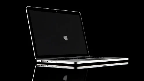 Laptop computer sits open on top of closed matching laptop