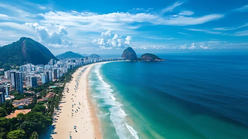Coastal metropolis curves along turquoise bay beneath mountains