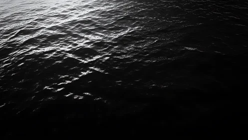 High-contrast rippled seawater with specular highlights and deep shadows