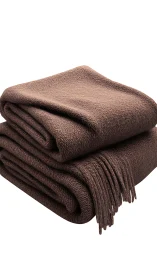 Stacked Wool Blankets with Fringe Detail.