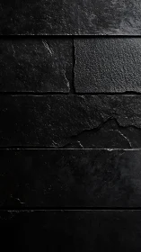 Dark textured slate wall with horizontal stone panels.