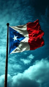 Puerto Rico flag waves on tall pole against cloudy sky