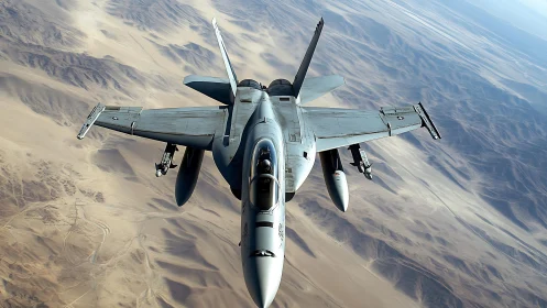 Military jet slices across sunlit desert mountains in flight