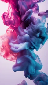 Colorful magenta and teal ink clouds swirling in liquid.
