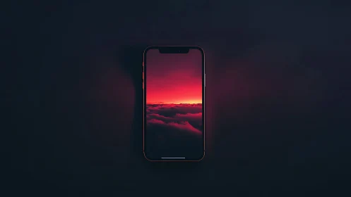 Smartphone display showing red cloudscape on dark field.