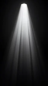 Minimalist spotlight beam in dark negative space composition.