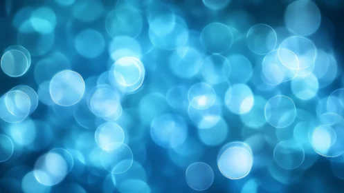 Soft Blue Bokeh Abstract Background with Light Circles.
