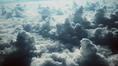 Cathedral of stormlit clouds above a softly glowing sky sea.