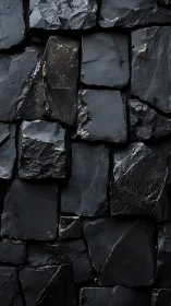 Deep black stone wall captures rugged architectural drama