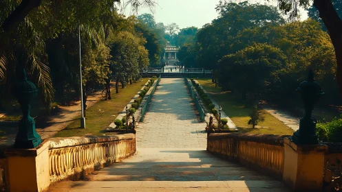 Stone walkway through formal garden toward distant pavilion.