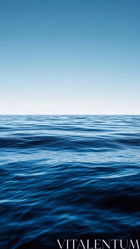 Endless blue ocean waves meeting a soft, peaceful sky.