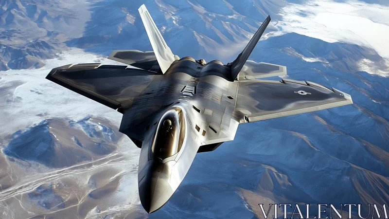 Stealth military jet aircraft flying above mountain terrain.