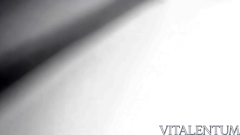 Monochrome diagonal shadow gradient across luminous plane.