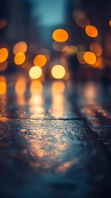 Rain-soaked city pavement reflects blurred golden bokeh lights.