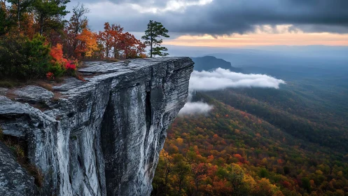 Morning light gently touches a dramatic mountain cliff edge