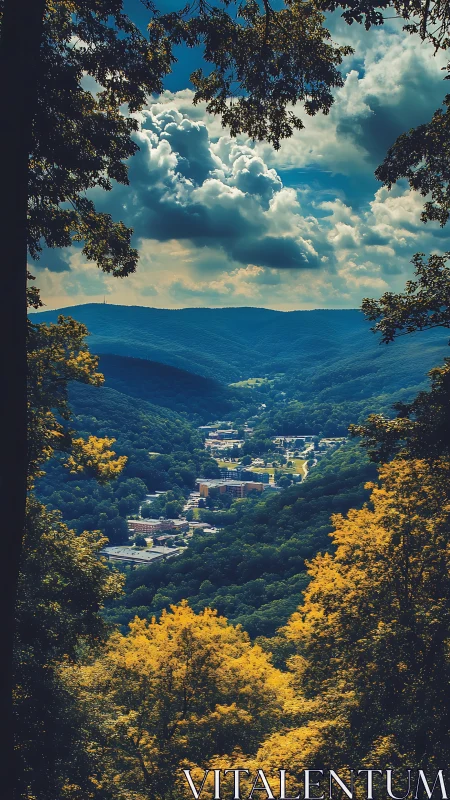 Mountain valley town framed by dense foliage in vivid hues