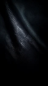 Dark synthetic textured surface with directional highlights.