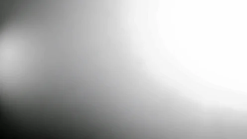 Minimalist grayscale gradient field with soft radial light structure.
