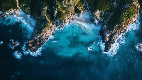 Aerial rocky coastline with turquoise surf and hidden coves
