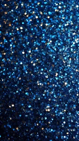 Deep blue glitter surface shimmers with festive, cosmic light