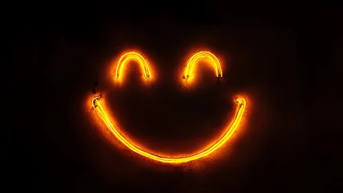 Neon smiley face glowing on dark minimalist background.
