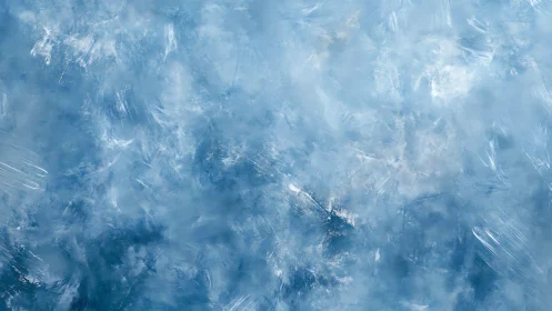Whispering frost clouds swirl across a dreamy blue hush.