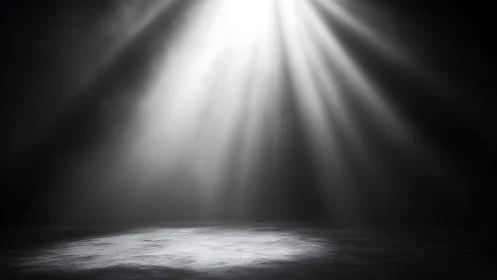 Spotlight beam illuminates textured floor in dark space