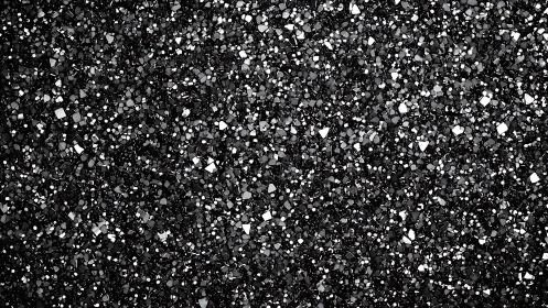 Dense black glitter surface with uniform reflective texture.