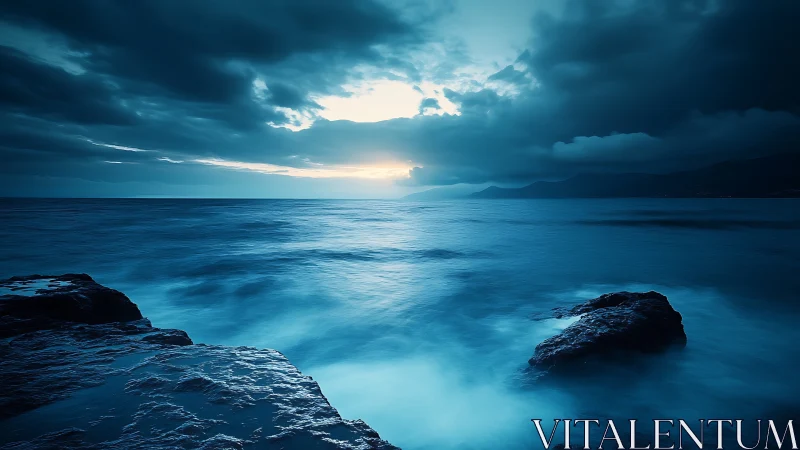 Twilight seascape with long exposure waves and rocky coast.