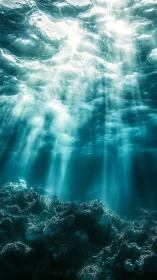 Sunlight beams penetrate clear turquoise ocean water.