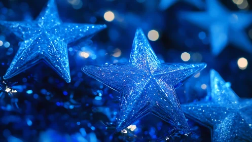 Photorealistic close-up of glittering blue star ornaments.