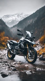 Adventure touring motorcycle stands in alpine riverbed scene