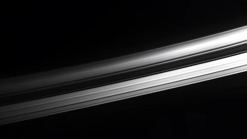 Monochrome diagonal bands traverse a dark background