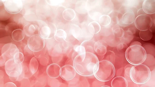 Translucent circular bokeh shapes overlay soft pink gradient