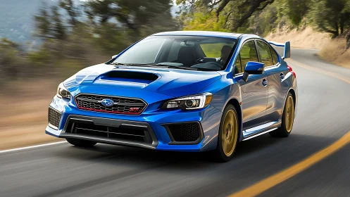 High-performance blue sports sedan powers through winding mountain road