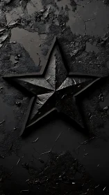 Textured black star emblem on distressed dark surface.
