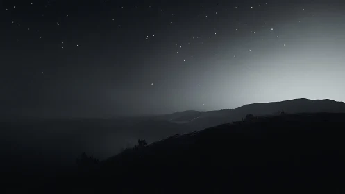 Soft starlit hills welcome the quiet glow of approaching dawn