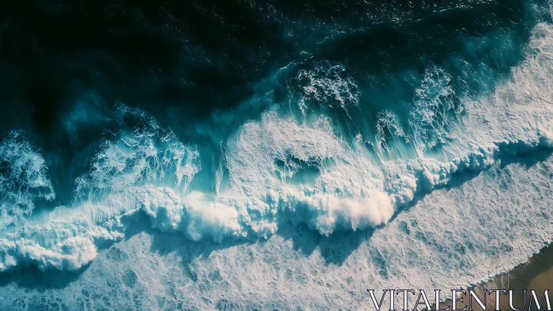 Aerial ocean surf crashes over turquoise coastal shallows.
