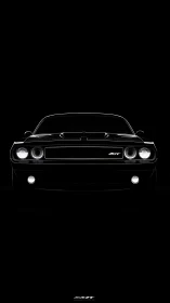 Muscle car front silhouette emerges from deep black void