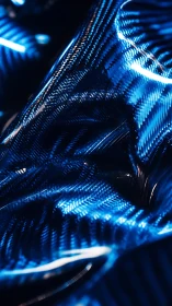 Close-up of blue reflective carbon fiber texture surface.
